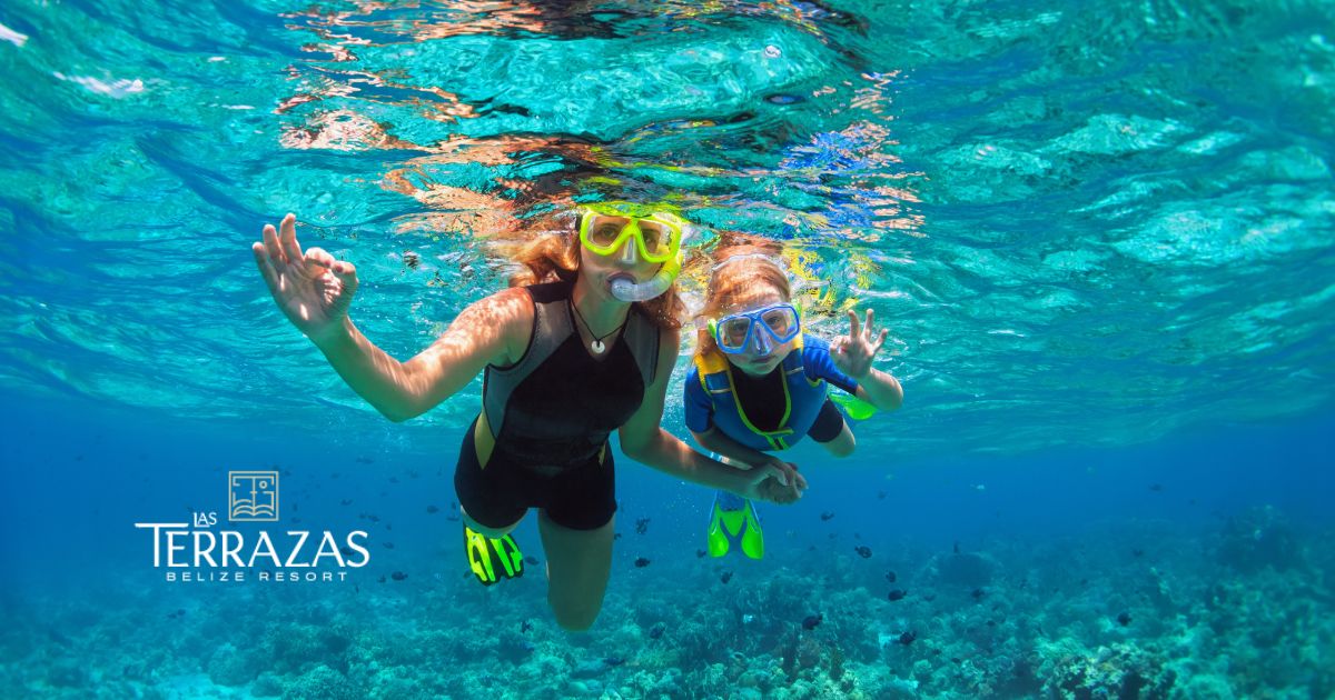 A family snorkeling along the Belize Barrier Reef.