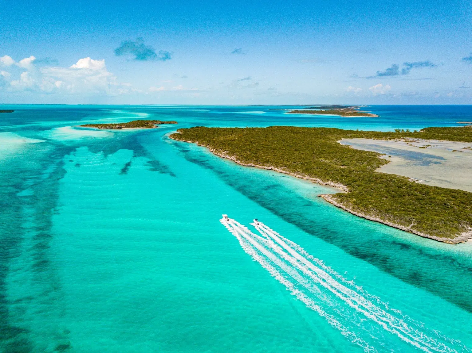 Aerial view of Ambergris Caye, Belize, with turquoise Caribbean water and a tropical island coastline