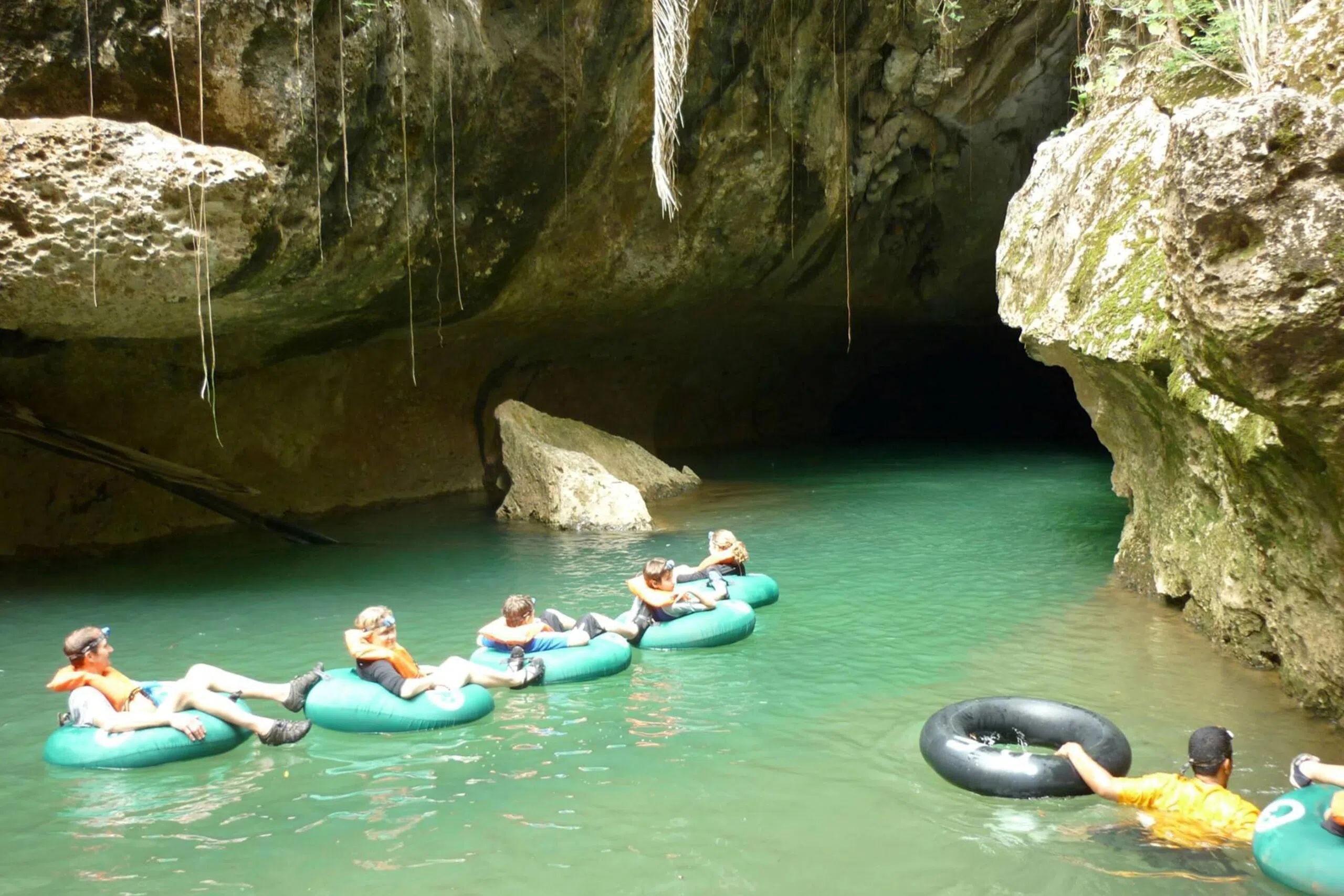 Cave tubing through jungle